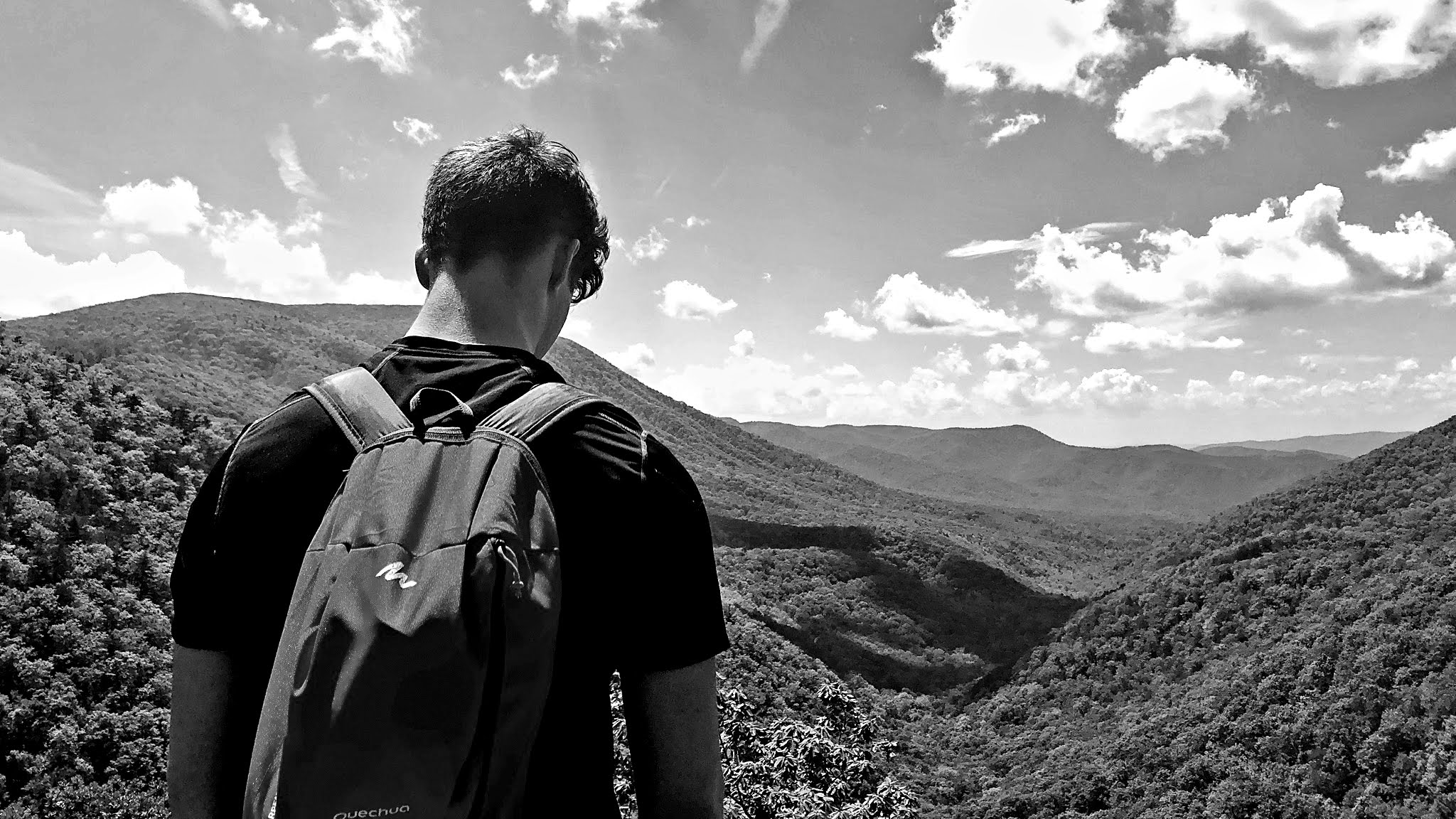 Francesco looking off into a mountain range